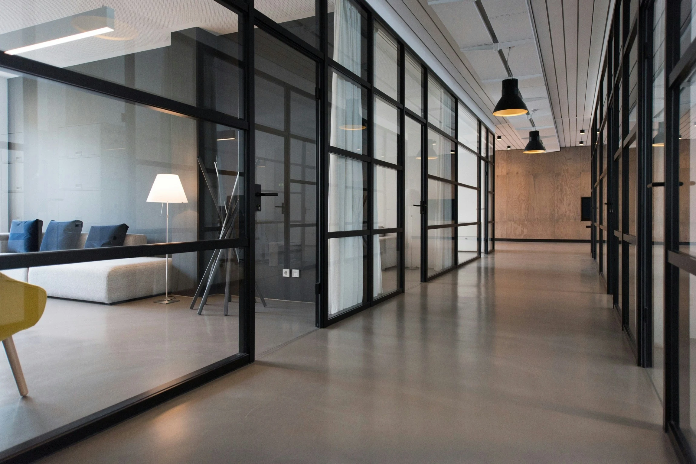 Contemporary office with glass partitions